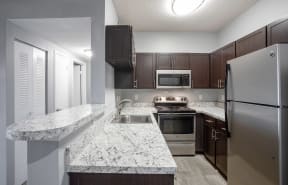 Kitchen with breakfast bar at Centennial Crossing Apartments in Nashville Tennessee