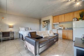 Living room & kitchen at University Manor Apartments in Tucson, AZ