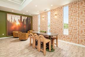A dining room with a wooden table and chairs.