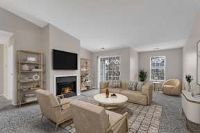 A living room with a fireplace and a television.