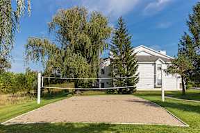 a volleyball court in front of a house