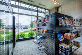 a store with a display of food in front of a window
