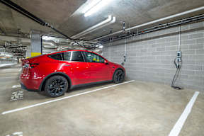 a red car parked in a parking garage