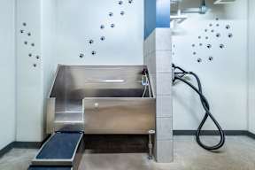 a public bathroom with a sink and a shower