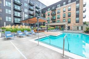 our apartments have a large pool and lounge chairs