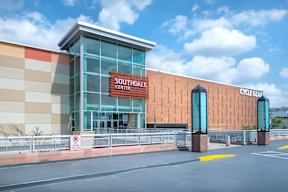 the exterior of a convention center with a sign on the side of the building