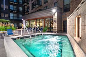 a swimming pool in a building with a hot tub