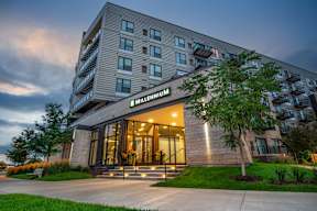 an exterior view of a hotel building at dusk