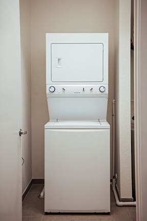 Stacked washer and dryer unit in laundry closet at Reserve on 3rd Apartments, Alabama, 35233