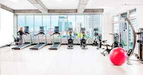 Fitness center with city views at Reserve on 3rd Apartments, Alabama, 35233