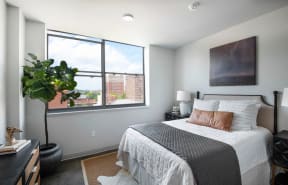 Studio, One & Two BR Apartments in Downtown Birmingham, AL - Market Lofts On Third - Spacious Bedroom With Large Windows And Historic Concrete Flooring