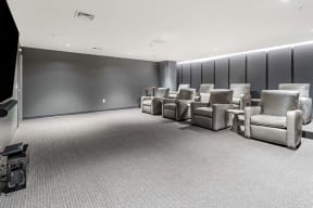 a waiting room filled with chairs and a tv