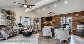 a living room with couches and chairs and a table