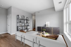 a living room with a white couch and a table