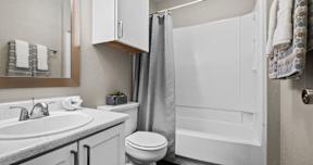 a bathroom with a sink toilet and a shower