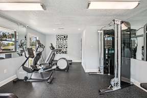 A gym with a sign that says "Don't stop when you're tired, stop when you're done."