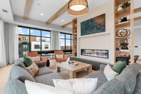 a living room with a couch and a fireplace
