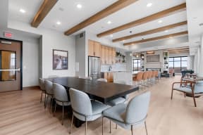 a large dining room with a long table and chairs