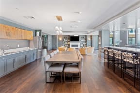 a kitchen and dining room with a table and chairs