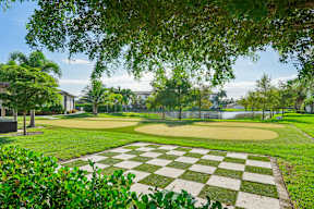 A checkered pattern is in the middle of a grassy area.