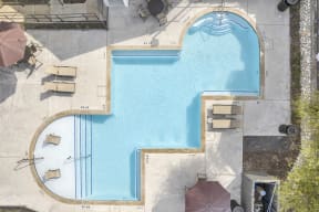arial view of a pool in a hotel with umbrellas