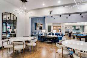 gorgeous renovated clubhouse with pool table and lounge seating