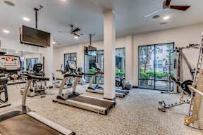 fitness center with cardio and weight equipment