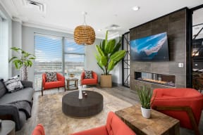 a living room with a fireplace and a tv