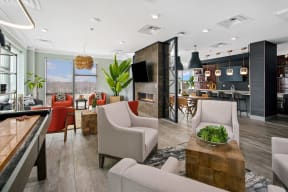 2-Bedroom Apartments in Mount Prospect, IL - 20 West - Clubhouse with Bar Style Seating, Comfy Lounge Seating, Elegant Lighting Fixtures, and Shuffleboard