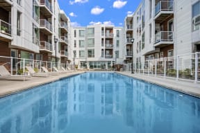 a swimming pool in the middle of an apartment building