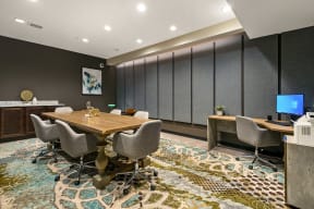 a conference room with a wooden table and chairs