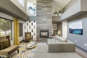a living room with a couch and a fireplace