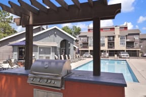the residences at the crossings apartments pool and clubhouse with a grill