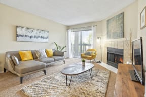 a living room with a fireplace and a couch