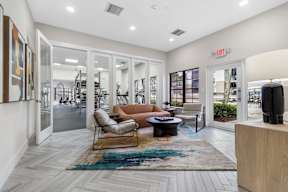 A living room with a couch, chair, and coffee table.