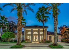 a house with palm trees in front of it