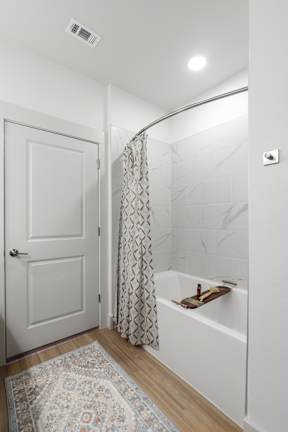 a bathroom with a large soaking tub