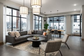 a living room with couches and chairs and a table