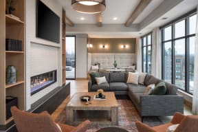 a living room with a couch and a fireplace