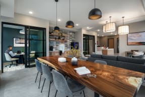 a dining room with a wooden table and chairs