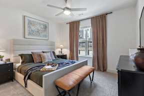 bedroom with a large bed and a ceiling fan