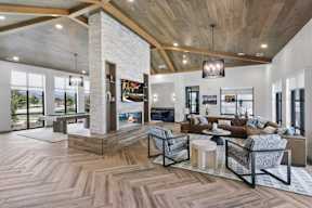a living room with a fireplace and a wooden floor
