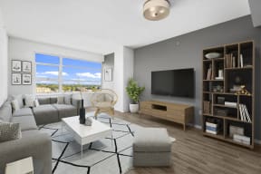 an apartment living room with a couch and a tv