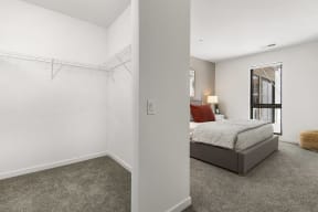a bedroom with a bed and a mirror