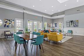 a living room with a table and chairs