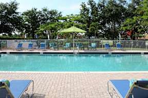Pool Area with lounge seatings and umbrellas