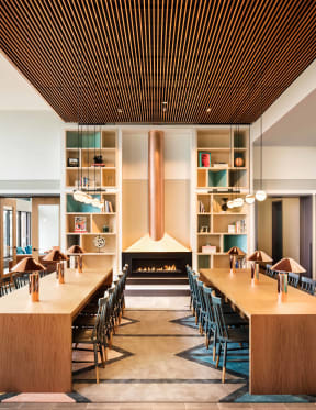 Living Library in Resident Clubhouse with Cozy Fireplace at Landmark West Loop Apartments in Chicago, IL