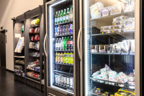 a refrigerator filled with drinks and food in a store