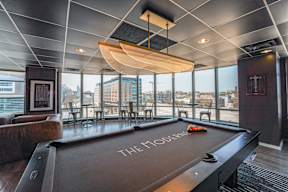 A pool table with the word "THE" written on it.