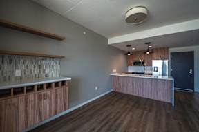 A kitchen with wooden cabinets and a countertop.